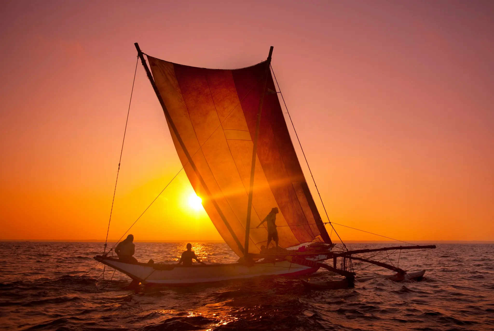 Fishermen on a catamaran, Sri Lanka